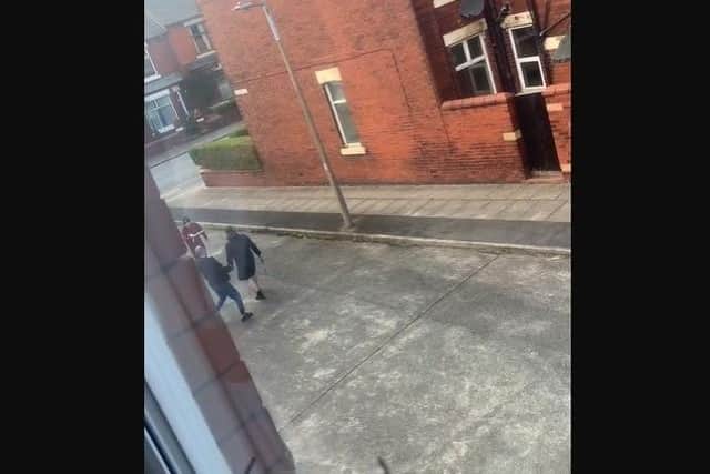 The men were seen fighting with machetes in a street off Tulketh Brow, Ashton on Thursday, April 13