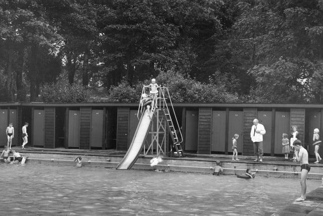 Getting ready to make a splash in the swimming pool via the big slide. This image is from 1958 and shows the baths as a popular choice for many residents of Preston