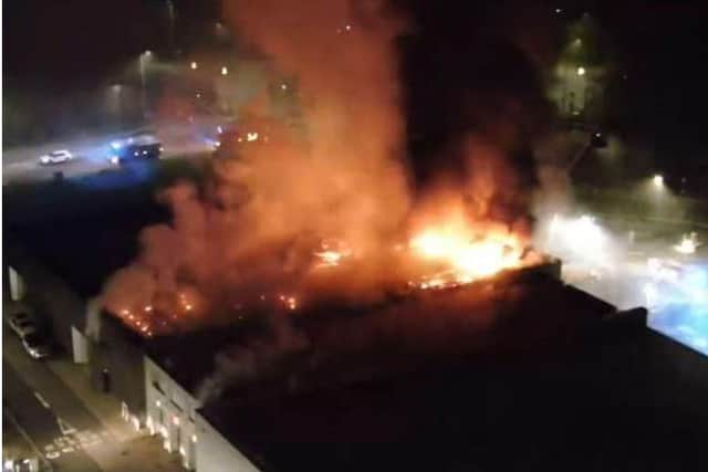 The Jaguar Land Rover car dealership was engulfed in flames in April when crews arrived (Credit: Lancashire Fire & Rescue Service)