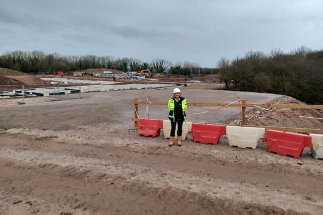 Female construction worker Lynn Johnson stands in front a site in Lancashire.