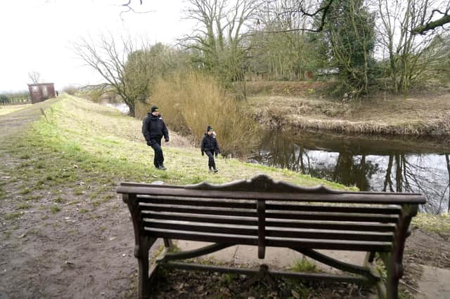 Police search teams near the bench where Nicola Bulley's phone was found at 9.35am. It was still connected to a work's conference call. Picture date: Saturday February 4, 2023.