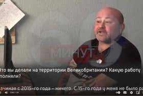 Leyland aid volunteer Paul Urey appearing in handcuffs on Russian TV.