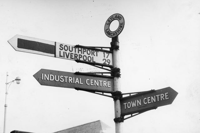 A signpost in Leyland, pictured in 1962, points toward its industrial centre