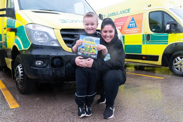 Five-year-old Theodore with his mum Ruth Naylor-Thomas and the book he inspired his mums to write - Hello Ambulance