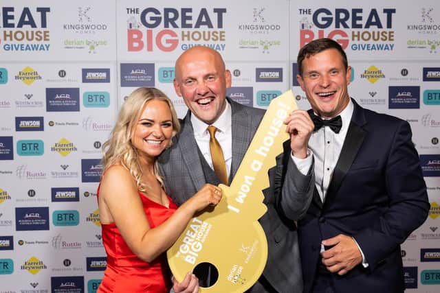Caroline Taylor, Head of Income, Marketing and Communications at Derian House Children’s Hospice, Charles Maughan (winner) and Paul Jones, Managing Director of Kingswood Homes, at the ball