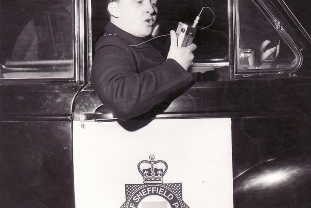 PC Stephen Sewell of Sheffield City Police uses a portable radio of a type used successfully in the Woodseats Division to increase efficiency - November 1966