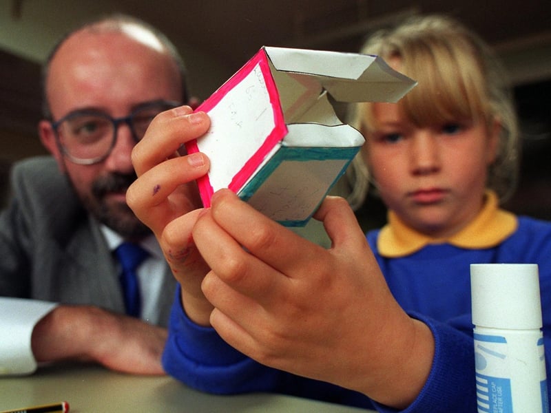 Pupil at St. Maria Goretti RC Primary school, Ribbleton, Laura Kitchen, aged seven, with Jim Morgan from Preston Borough Council, during the school's industry day