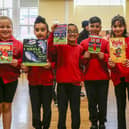 Preston St Matthews Church of England Primary School pupils Sienna, Pilray, Hamzah, Owais, Nabiha, and Izzah with their new books from the Young Reader’s Programme event