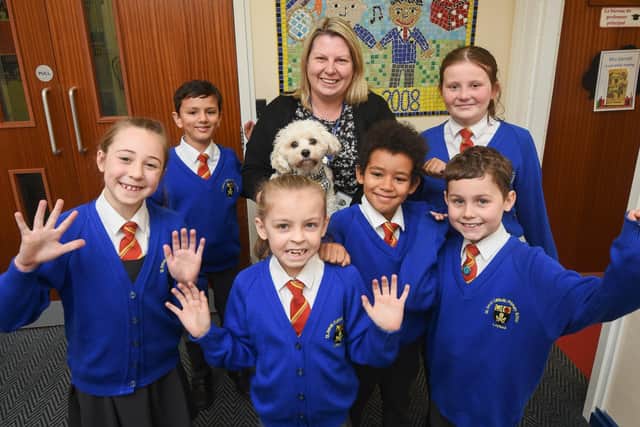 St Anne's Primary in Leyland is celebrating after getting a 'Good' Ofsted report. Pictured is headteacher Liz Darnell with pupils.
