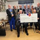 Members of the Red Rose Provincial Grand Lodge with their donation for Rosemere Cancer Foundation, which Provincial Grand Primo Steve Farrell (fourth from the right) helped to raise by braving the shave