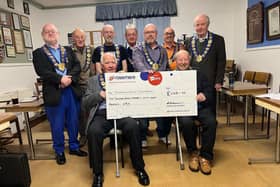 Members of the Red Rose Provincial Grand Lodge with their donation for Rosemere Cancer Foundation, which Provincial Grand Primo Steve Farrell (fourth from the right) helped to raise by braving the shave
