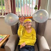 Resident Joyce enjoyed balloon weightlifting