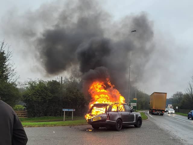 A grey Land Rover burst into flames on Lodge Lane, Leyland. (Photo by Phil Gardner)
