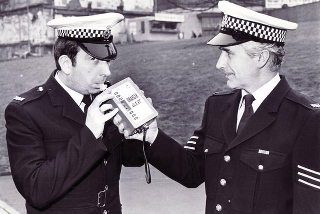 P.C. Charles Auty (left) and Sgt John Fryer of South Yorkshire Police in Sheffield with the new Draeger electronic roadside breathalyser box which replaced the bag and tube - 18th March 1986