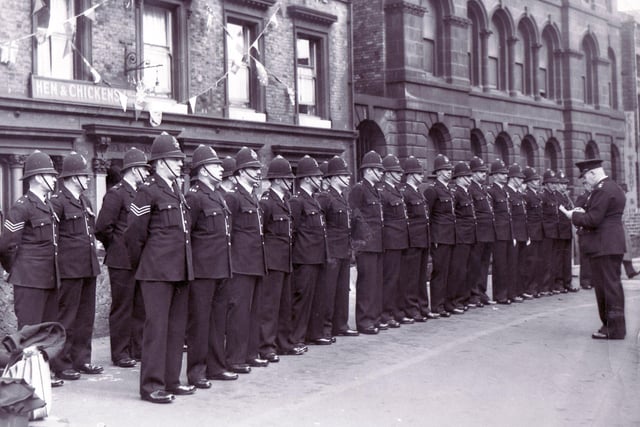 Sheffield Police line up on Castle Green outside the Hen & Chickens