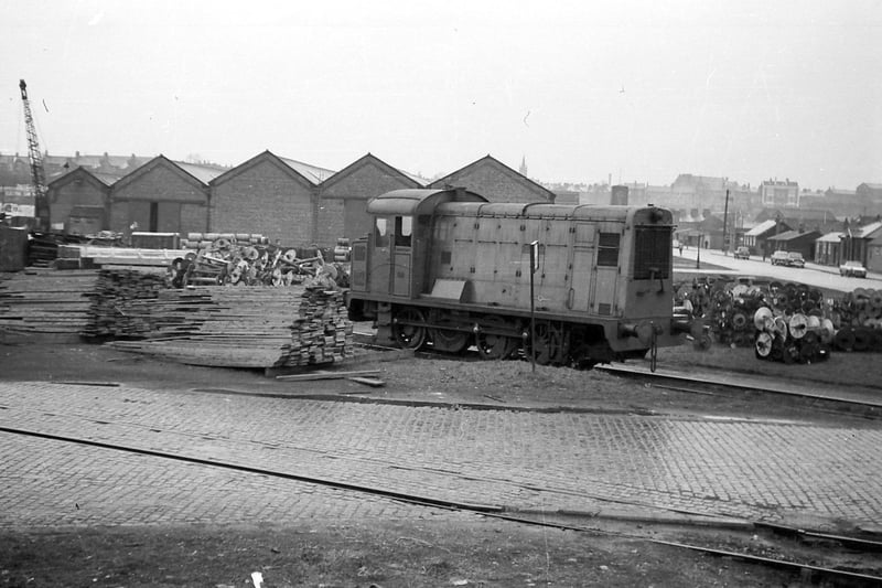 'Duchess' February 1961 Preston Dock
In March 1935 this locomotive was purchased by the Preston Corporation. Its works number was D8, it later gained the name 'Duchess' and was still in operation during 1960, and was noted withdrawn as late as the winter of 1968. It would be scrapped during 1969.

A large number of redundant warping beams can be seen stacked behind the loco, no doubt destined to Wards scrap metals which is directly behind the photographer.

A number of Tony Gillett's hitherto unpublished photographs of Preston's railway scene are due to appear in a new book by Robert Gregson. Tony was a fireman at Lostock Hall MPD and a neighbor of mine when I lived in the Savick area of Preston.

Photo: Courtesy of Tony Gillett
