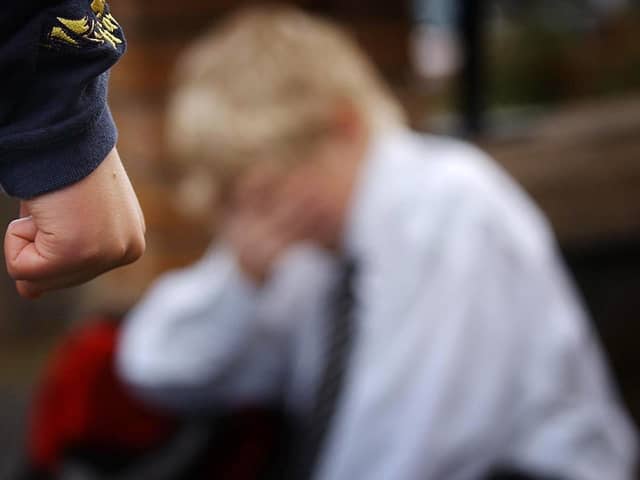 A posed image simulating a child being bullied.