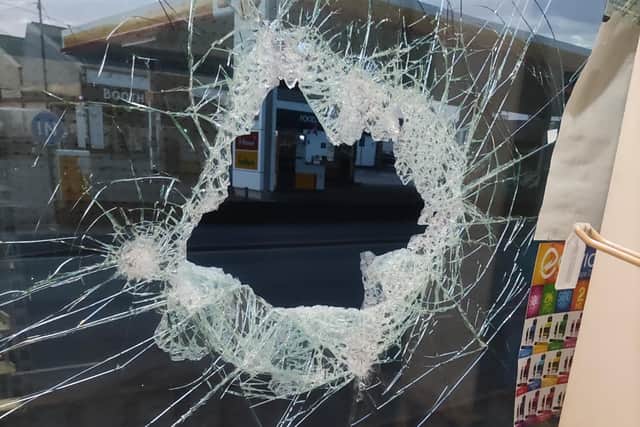 Numerous Longridge businesses have had doors and windows smashed - this is the damaged window at Berry Lane Newsagent