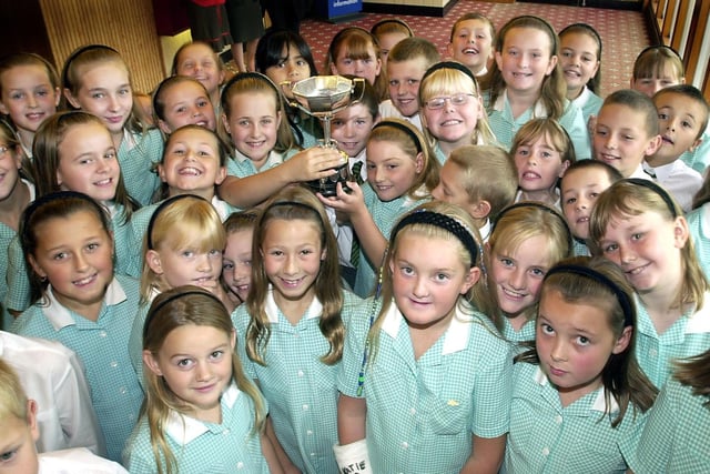 Shakespeare School choir with the trophy they won at the Music and Arts Festival in Fleetwood
