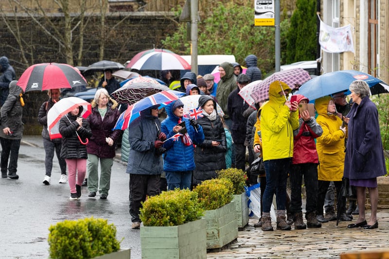 Crowds brave the rain awaiting the arrival of Princess Anne to Trawden. Photo: Kelvin Lister-Stuttard