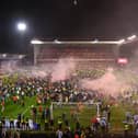 Nottingham Forest fans invade the City Ground pitch after their play-off semi final win over Sheffield United.
