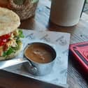 The Chamo chicken arepa and the pot of gravy that came with the Chamo fries.