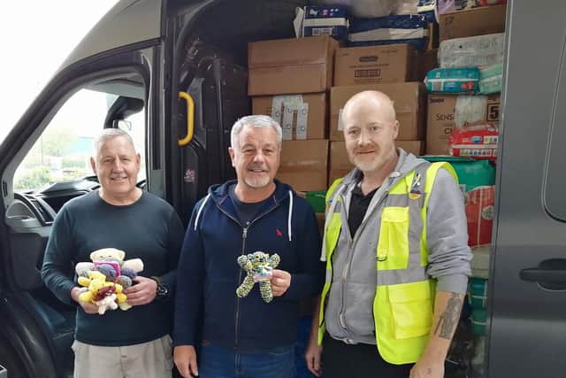 Left to right:  Frank Liszczyck, Steve Norris and Stuart Clewlow with the Chorley and District van of donations, 'Endeavour' and the teddies