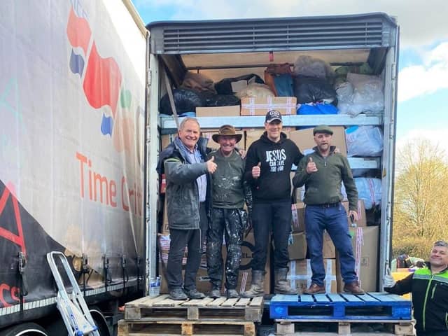 Loading one of the many trucks, filled with donations