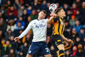 Preston North End's Ben Woodburn battles with Hull City's Greg Docherty