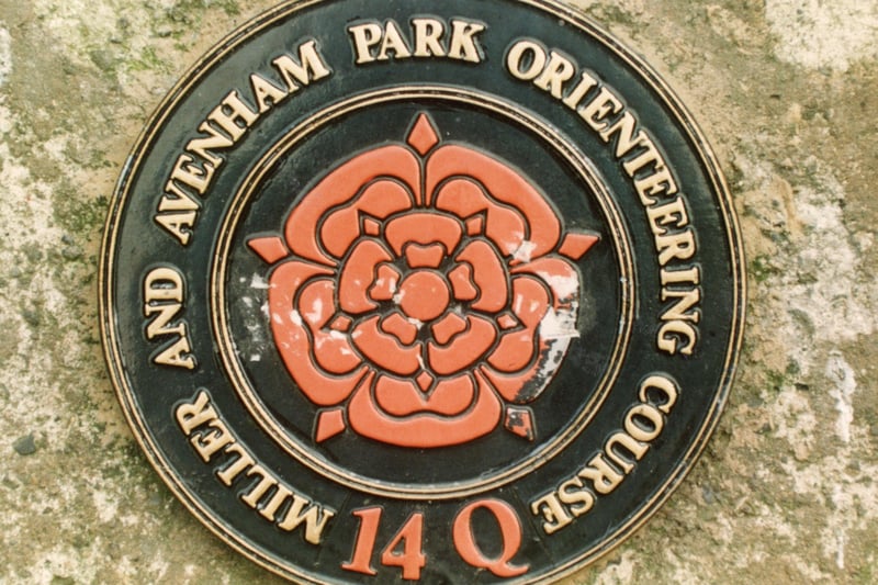 This plaque from 1991 marks an orienteering control point on a course found on Avenham and Miller Parks