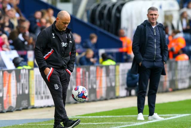 Stoke City manager Alex Neil controls the ball at Deepdale.