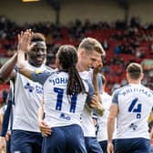 Preston North End midfielder Daniel Johnson celebrates scoring his side's second goal with team mate Bambo Diaby and Emil Riis