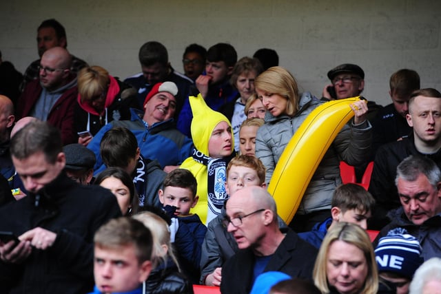 Preston North End fans watch their team in action