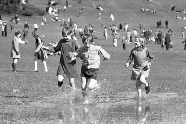 The gloomy forecasts of the weather men were happily proved wrong, as thousands of holidaymakers poured on to the sunny slopes of Avenham Park for the traditional Easter Monday egg-rolling festival. Though anybody who felt like cooling themselves could paddle in the large pools of rain water - the aftermath of a wet weekend