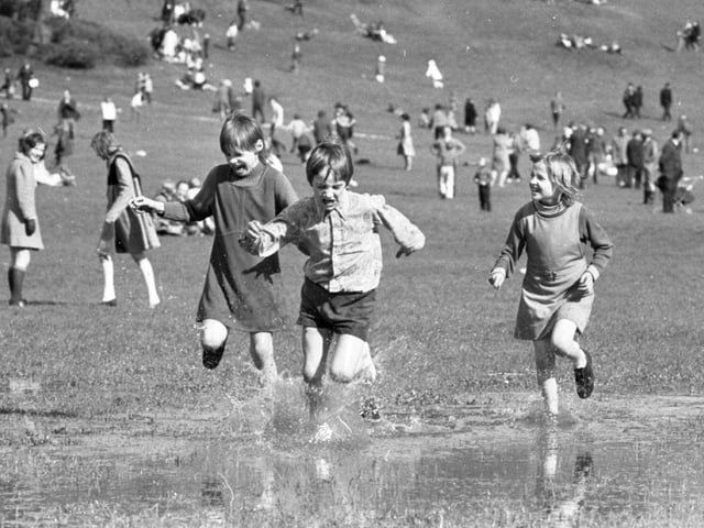 The gloomy forecasts of the weather men were happily proved wrong, as thousands of holidaymakers poured on to the sunny slopes of Avenham Park for the traditional Easter Monday egg-rolling festival. Though anybody who felt like cooling themselves could paddle in the large pools of rain water - the aftermath of a wet weekend