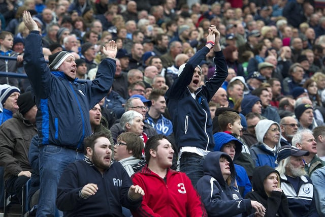 Preston North End fans celebrate after their team's performance.