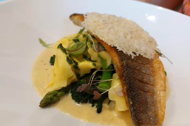 Pan seared fillet of seabass, spinach and ricotta tortellini with a smoked garlic and parmesan cream
