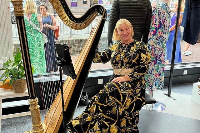 A harpist was on hand to entertain guests to the store