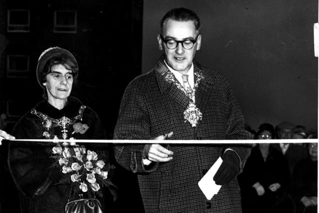 The official opening of the Moor Lane flats by the Mayor of Preston Coun J Atkinson accompanied by the Mayoress Mrs Atkinson. Coun Atkinson cuts the tape to officially open the Elizabeth Street flats