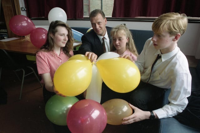 Louise McGough, Tracy Shaw and Ian Parkinson, of Tulketh High School, make a balloon sculpture with former pupil Gary Hornbuckle during the school's industry day
