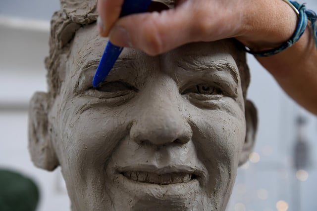 Leyland sculptor Stephanie Jane Matthews working on her collection of The Famous Five footballers from Hibs in Scotland.