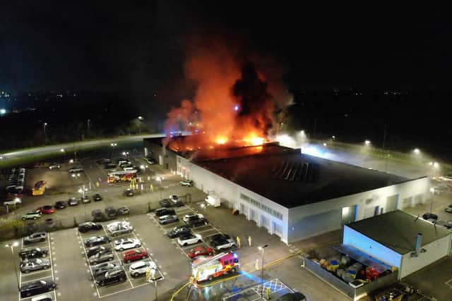 A large fire broke out at a luxury car dealership in Preston (Credit: @LancashireFRS)