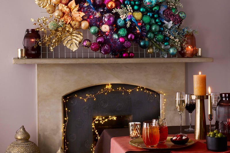 Dobbies says: "Embellished decorations and baubles, with an opulent and luxe feel. Moody colours, jewel tones and pops of vibrant orange and pink bring this rich, bold theme to life. Colour palette features Striking Purple, Fuchsia Purple, Persimmon Orange, Emerald and Brushed Gold."