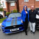 Adlington couple Bridget Alexander and John Nelson are offering free rides in sports cars to teens to help families who cannot afford the mounting costs of school proms. Photo: Kelvin Stuttard