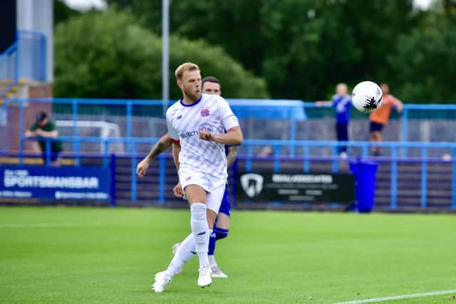 Harry Davis lobs in an early goal for Fylde (photo: Steve Mclellan/AFC Fylde)