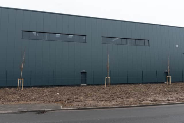 The sparse saplings - seen here on the Eastway elevation of one of the warehouses - have been mocked