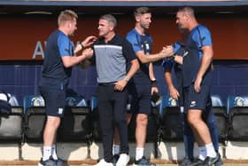 Ryan Lowe, first team coach Paul Gallagher and goalkeeping coach Mike Pollitt react to the final whistle on Saturday.