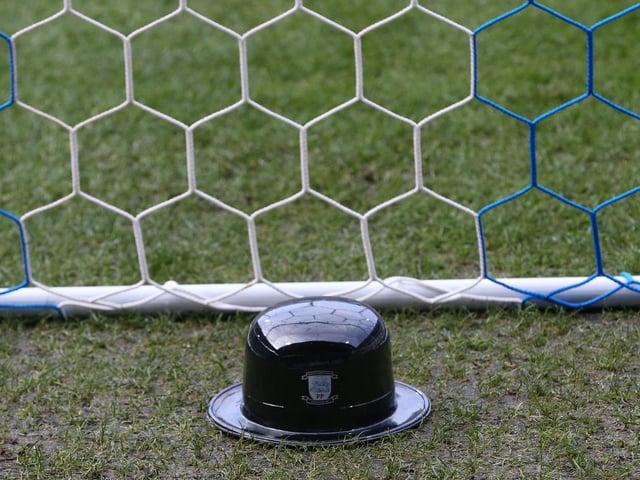A bowler hat makes its way onto the playing surface at Bolton in 2018