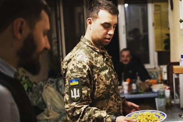 Kyle helping with the food in Ukraine