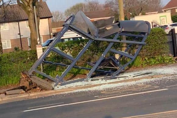 The force of the crash uprooted the bus stop from the pavement and left it a mangled wreck